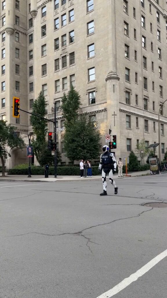 Robot police officer crossing Sherbrooke Street